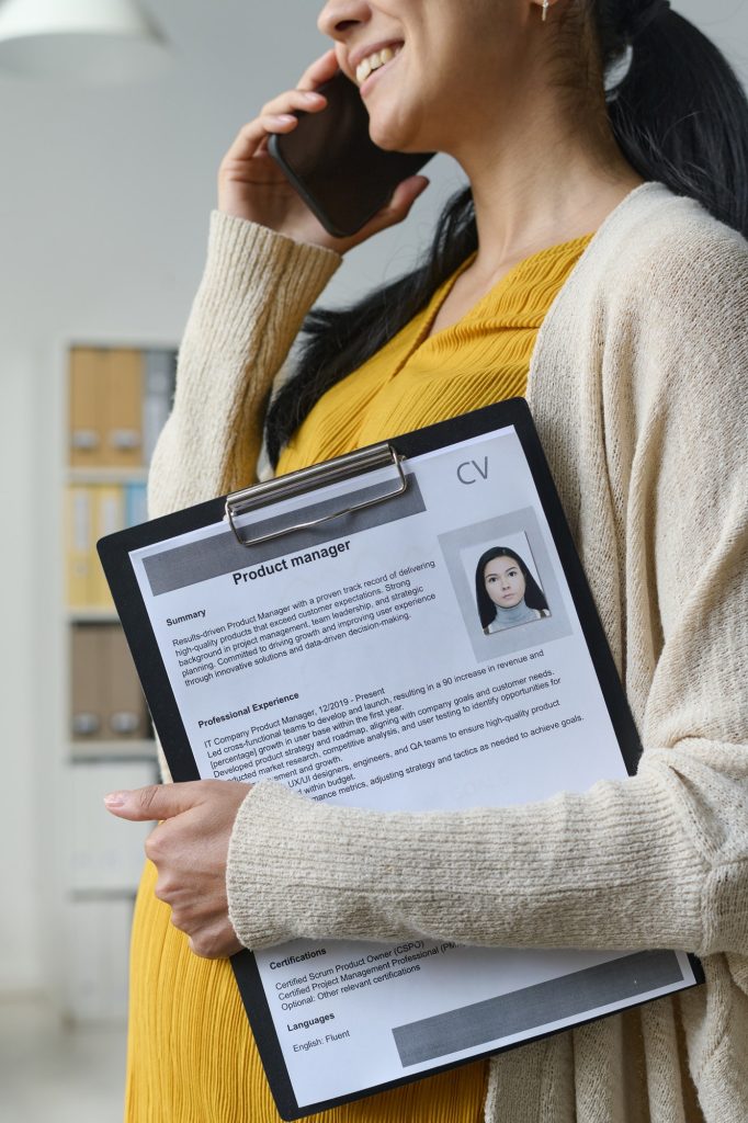 Pregnant businesswoman talking to new candidate